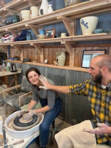 John and Helen being playful in the pottery studio