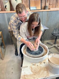 Making pottery on the wheel